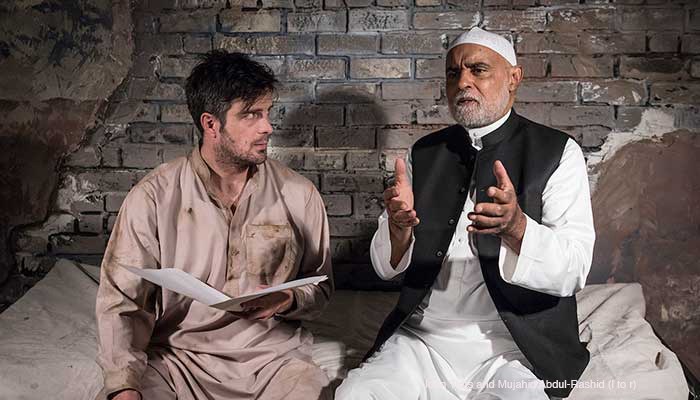 John Tufts and Mujahid Abdul-Rashid in ETC's production of "The Invisible Hand," photo by David Bazemore.