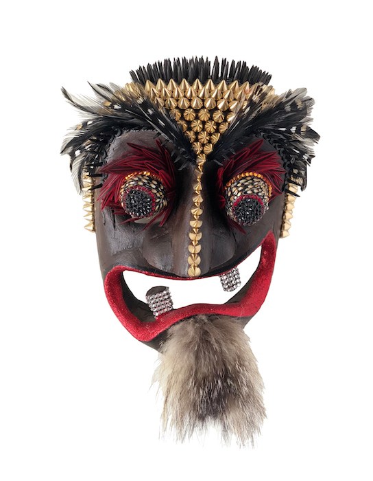 Lynn Cunningham Brown, "VaVaVaVoom," vintage Balinese hand-carved wood mask embellished with studs, Swarovski crystals, tacks, weasel fur, glitter, Chinese rooster and jungle cock feathers, 10x7x4 inches, on view at 10 West Gallery.