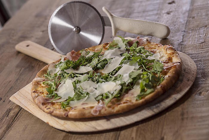 Arugula + Prosciutto Pizza at Mizza Artisan Pizza and Italian Cuisine, courtesy photo.