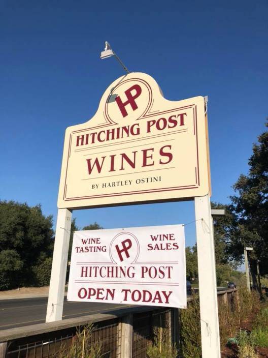 A sign welcomes visitors to the new Hitching Post Wine Tasting Room.