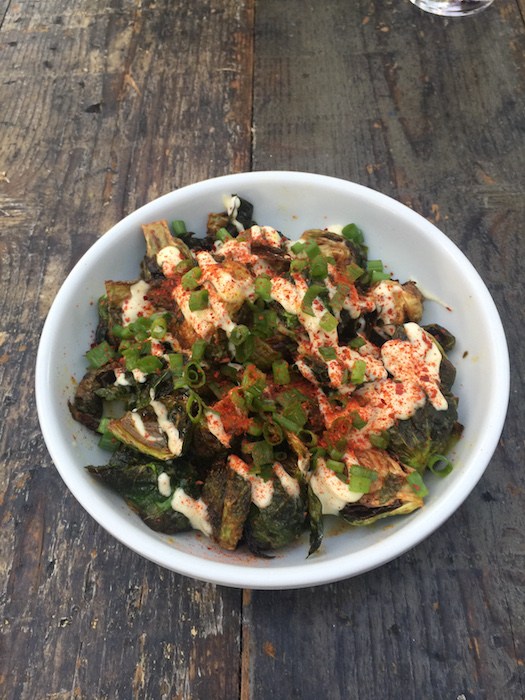 Outpost’s Fried Brussels Sprouts with Yellow Curry, Roasted Garlic Aioli and Chili Flakes, photo by Leslie Dinaberg.